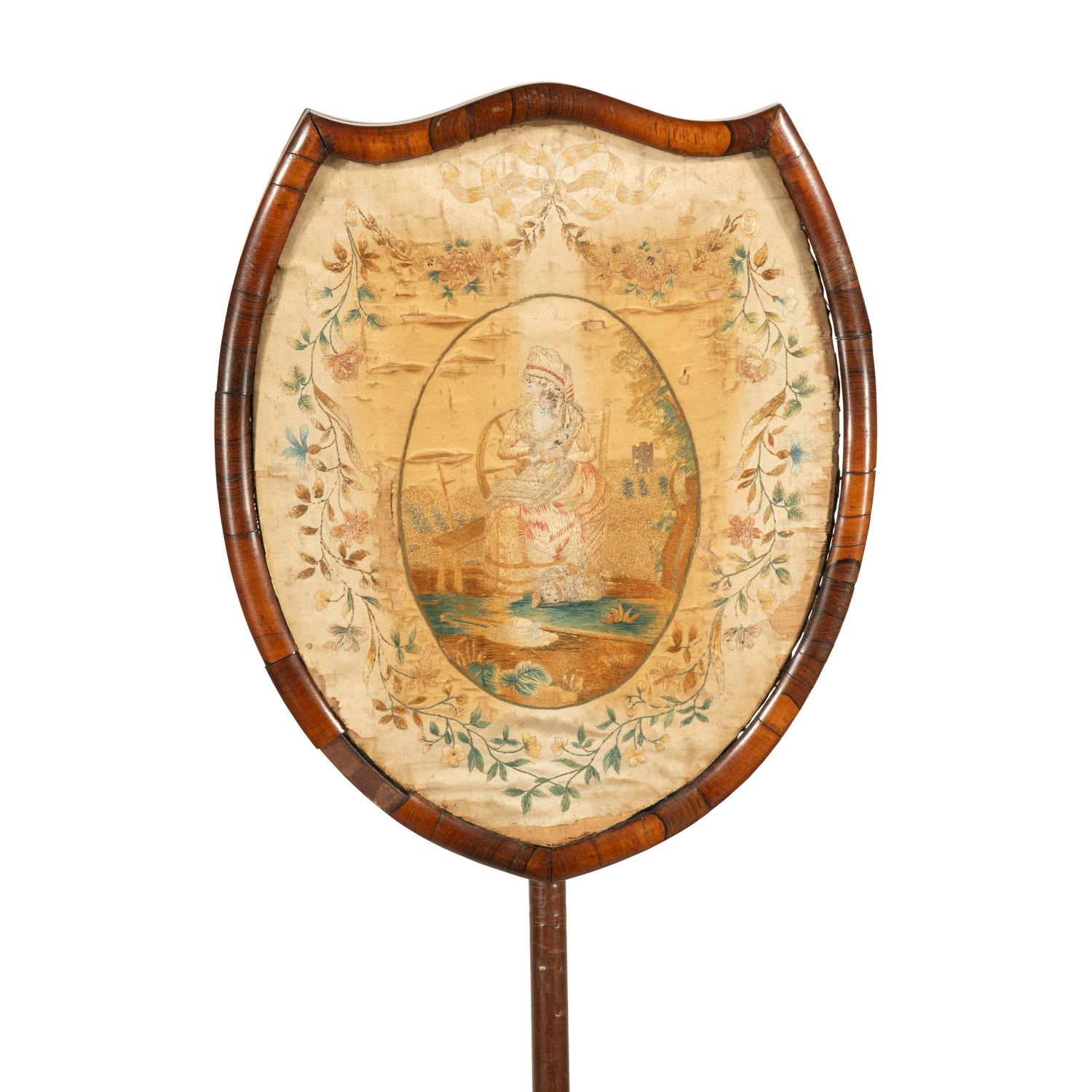 A Regency Needlework Upholstered Shield-Form Fire Screen