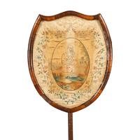 A Regency Needlework Upholstered Shield-Form Fire Screen