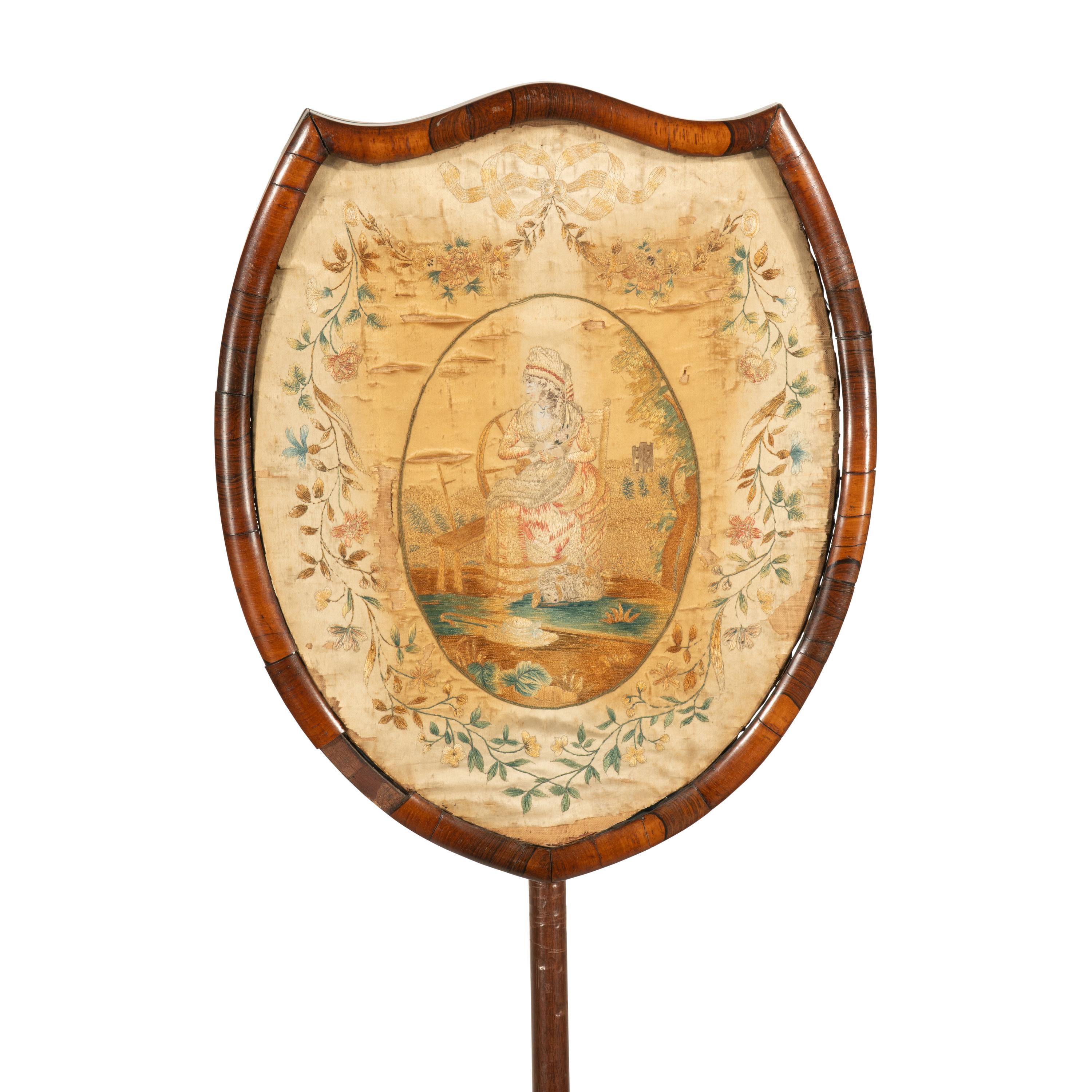 A Regency Needlework Upholstered Shield-Form Fire Screen