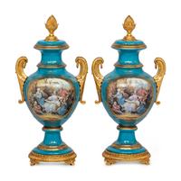 A Pair of Sèvres Style Porcelain Urns