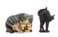 Two Cast Iron Doorstops Height of tallest 10 inches.