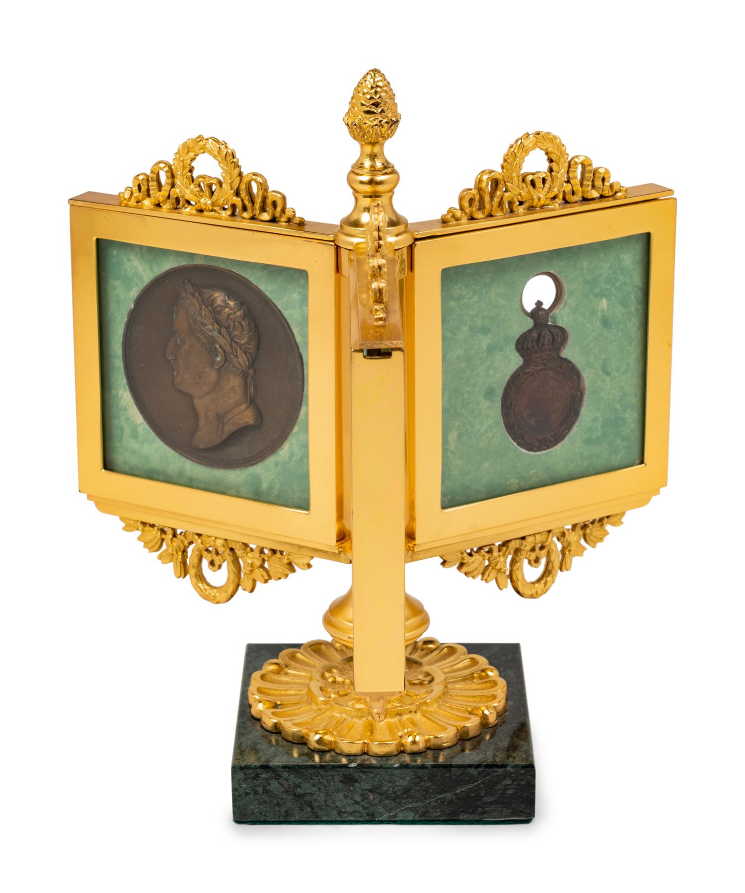 An Empire Style Gilt Bronze Tripartite Frame on Stand