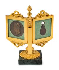 An Empire Style Gilt Bronze Tripartite Frame on Stand