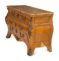 A Régence Style Gilt Metal Mounted Breche d'Alep Marble Top Commode