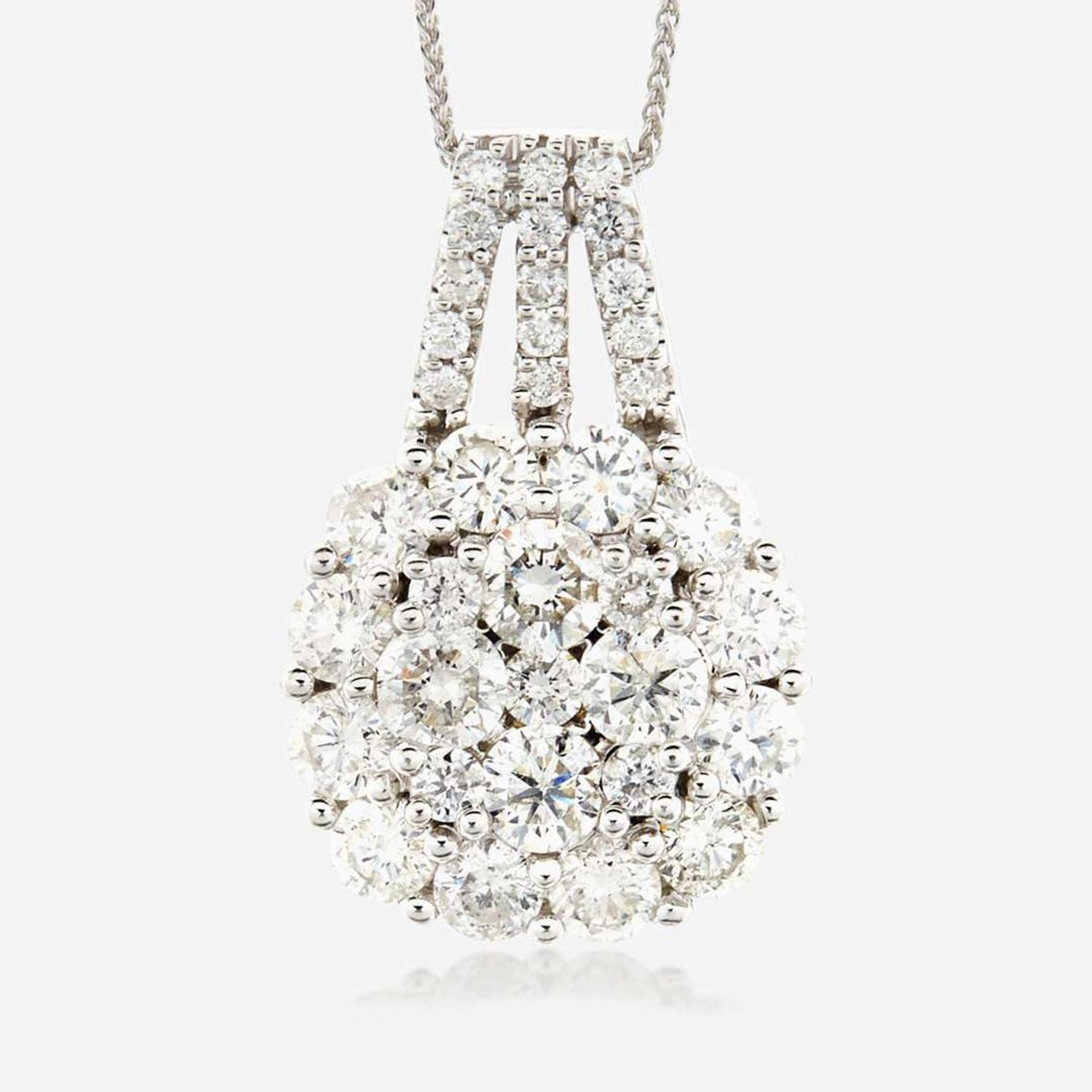 A diamond and fourteen karat white gold pendant