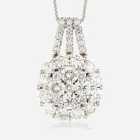A diamond and fourteen karat white gold pendant