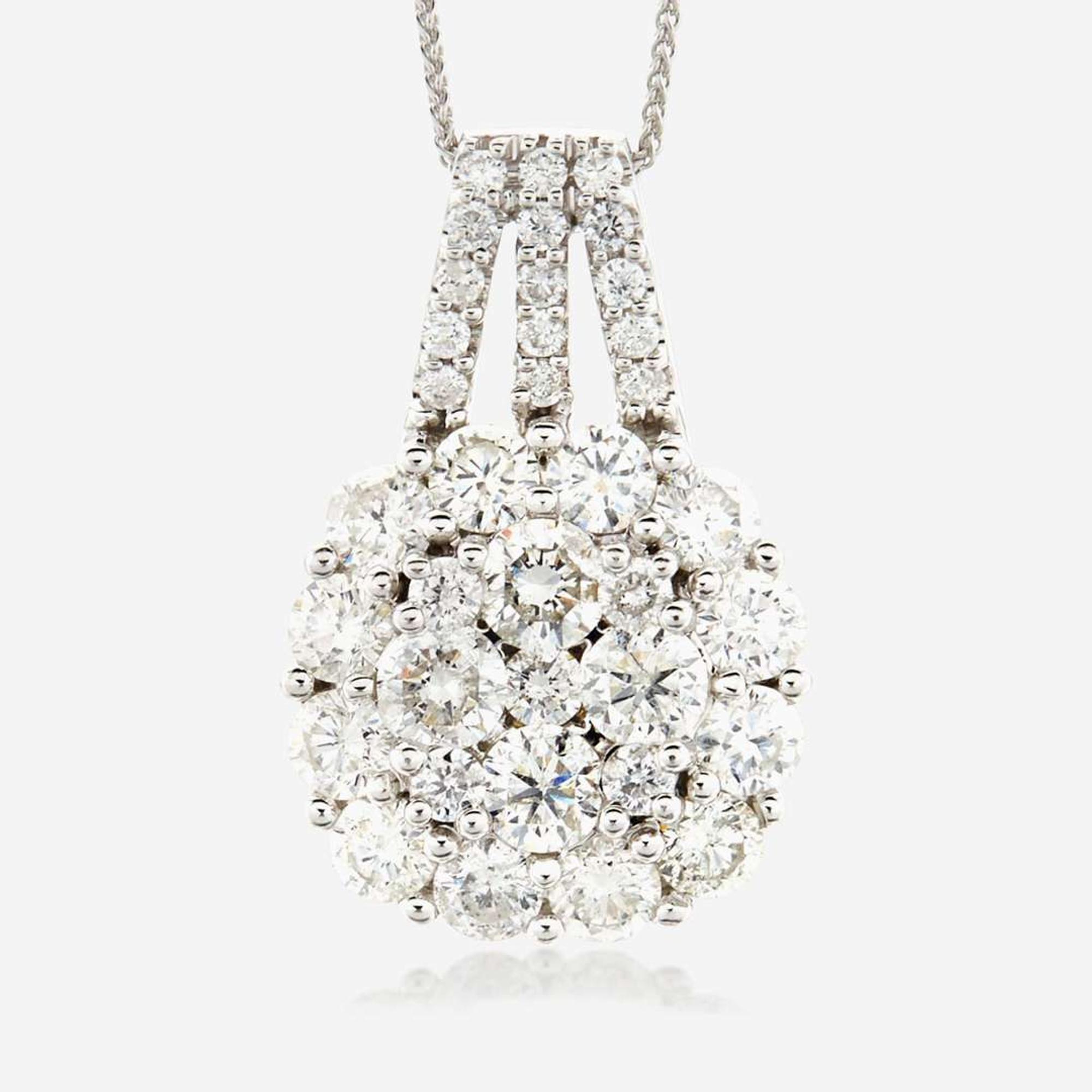 A diamond and fourteen karat white gold pendant
