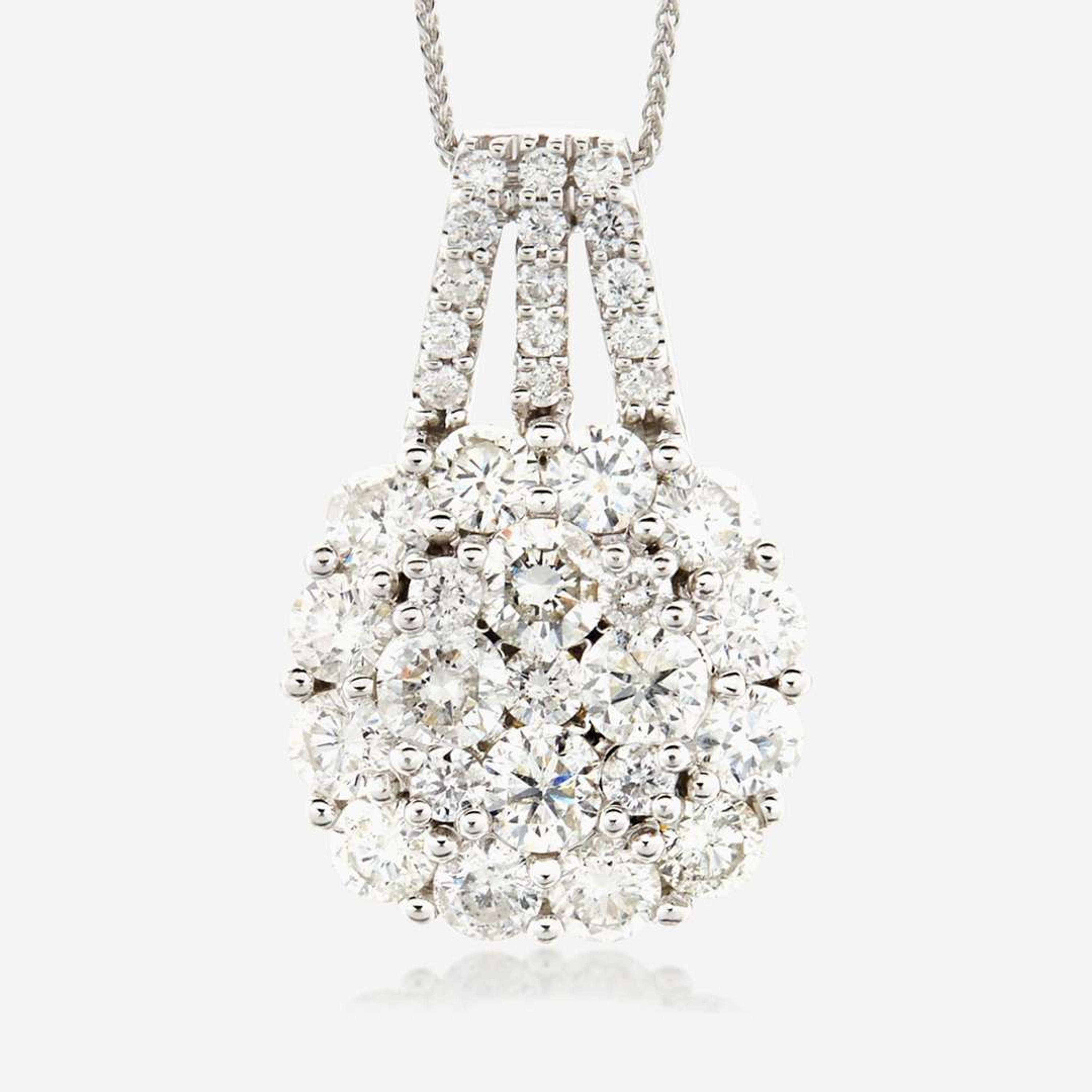 A diamond and fourteen karat white gold pendant