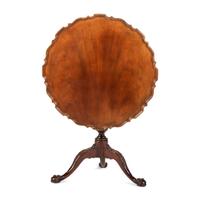 A Chippendale Style Carved Mahogany Pie-Crust Tilt-Top Tea Table