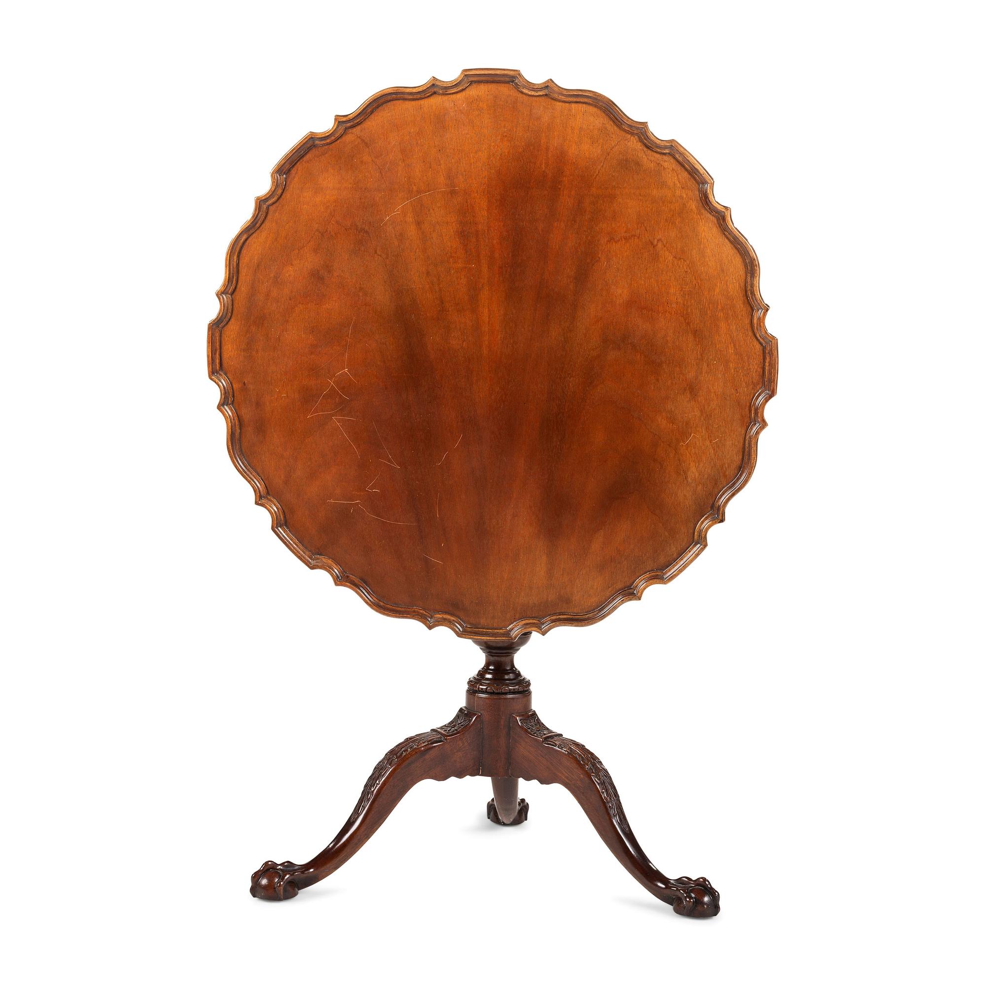 A Chippendale Style Carved Mahogany Pie-Crust Tilt-Top Tea Table