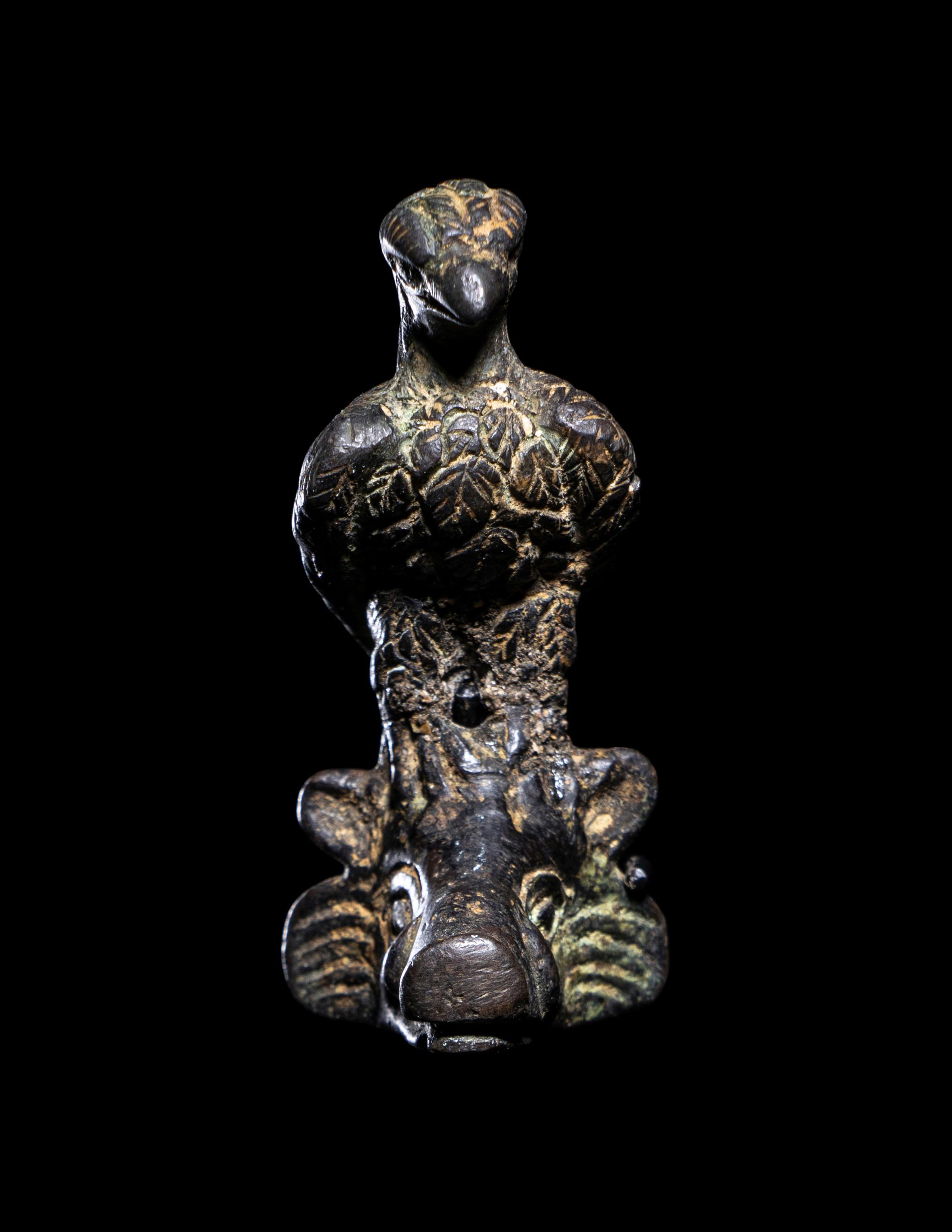 A Roman Bronze Eagle Perched on a Boar's Head
