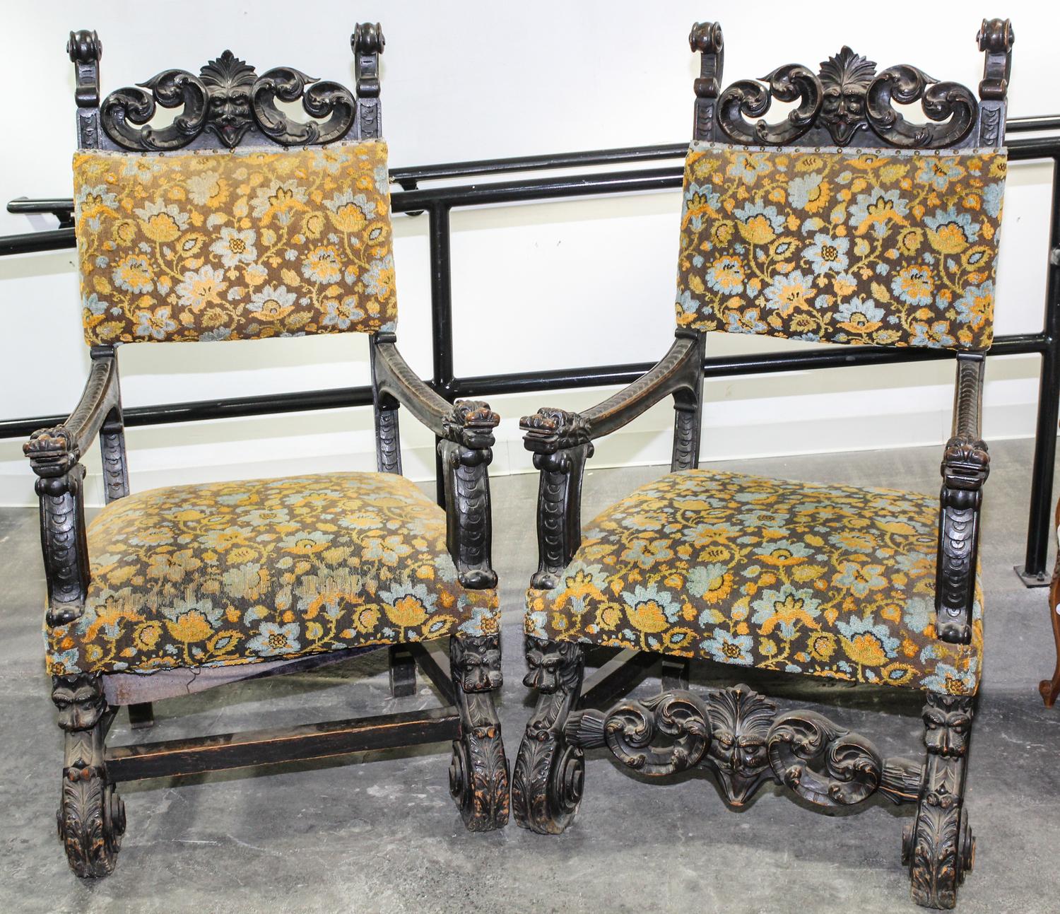 A Pair of Renaissance Revival Carved Open Arm Chairs. Height 53 1/2 inches.
