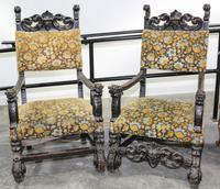 A Pair of Renaissance Revival Carved Open Arm Chairs. Height 53 1/2 inches.