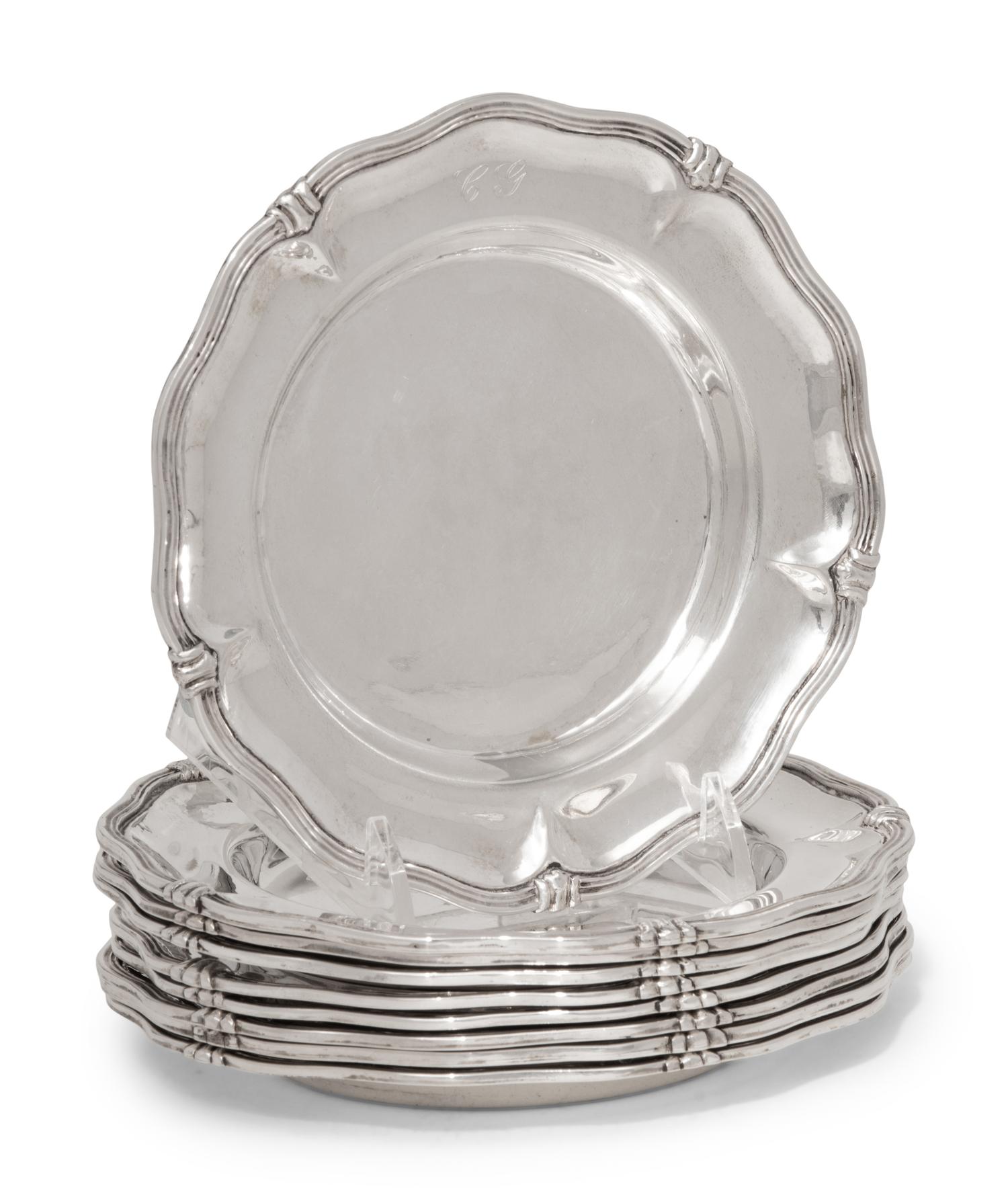 A Set of Nine Silver Bread Plates