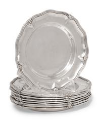 A Set of Nine Silver Bread Plates