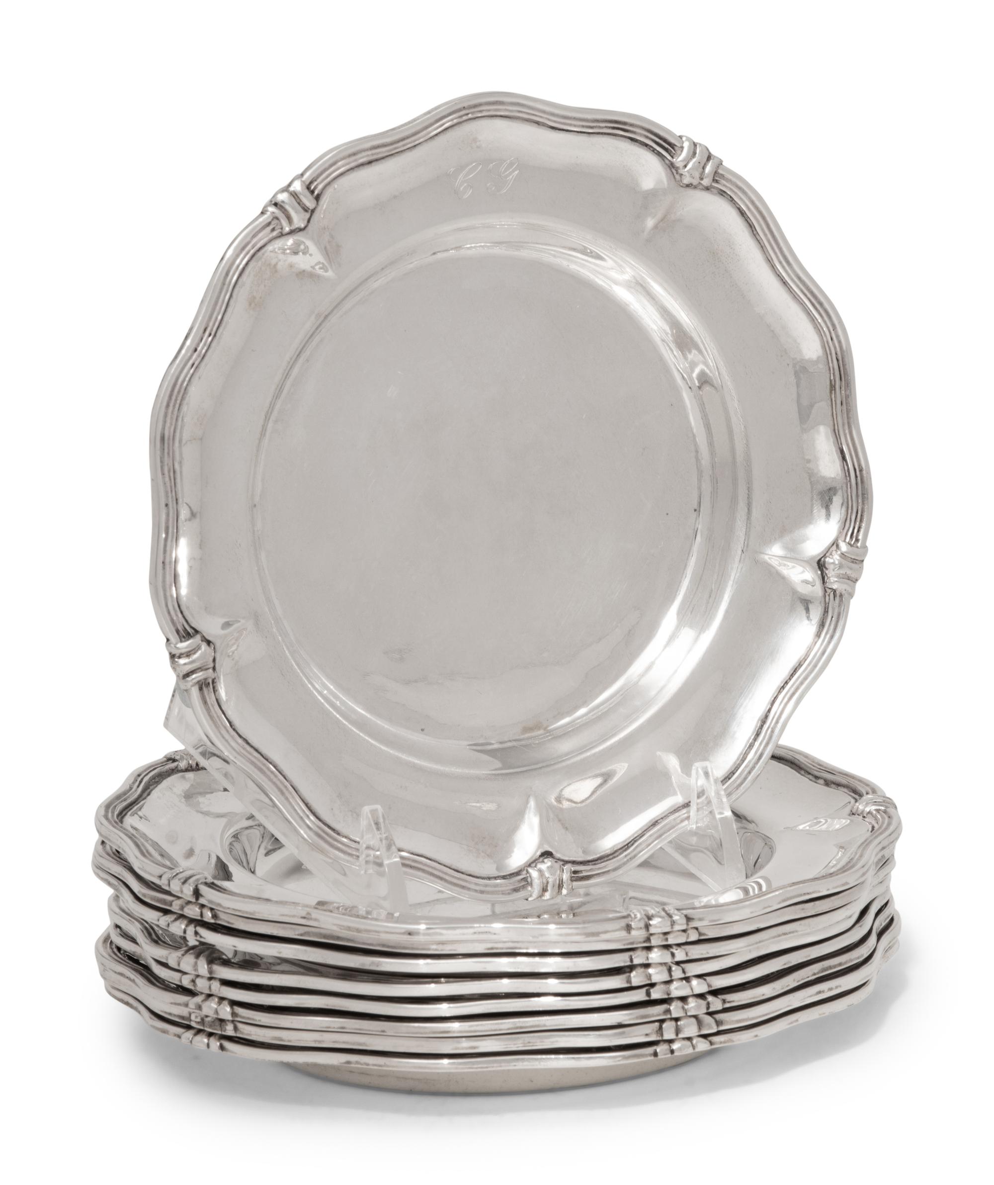 A Set of Nine Silver Bread Plates