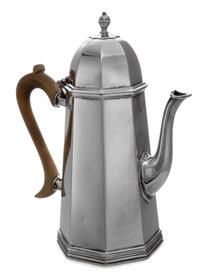 A Victorian Silver Coffee Pot, Charles Stuart Harris, London, 1897, having an ovoid finial surmounting a paneled octagonal body.