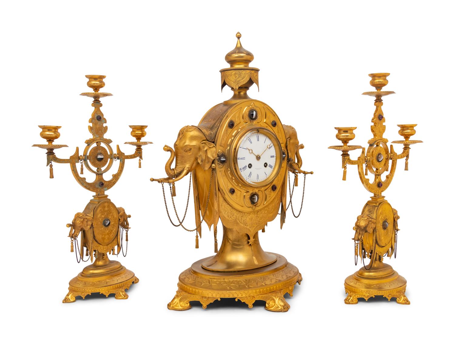 An English Orientalist Gilt Bronze Three-Piece Clock Garniture