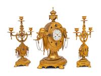 An English Orientalist Gilt Bronze Three-Piece Clock Garniture