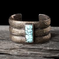 Mitchell Calabaza (Kewa, b. 1959) — Tufa Cast Silver and Turquoise Cuff Bracelet