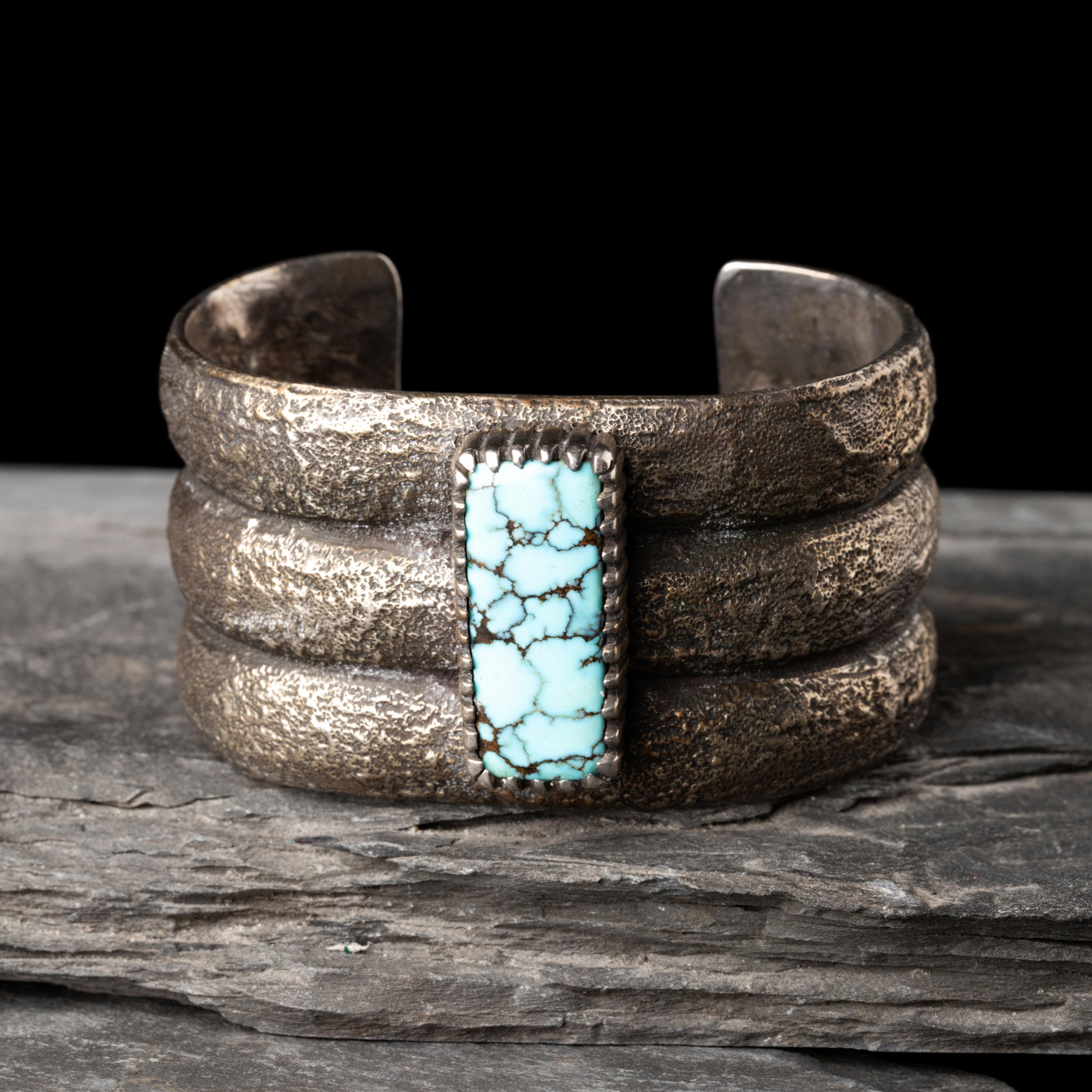 Mitchell Calabaza (Kewa, b. 1959) — Tufa Cast Silver and Turquoise Cuff Bracelet