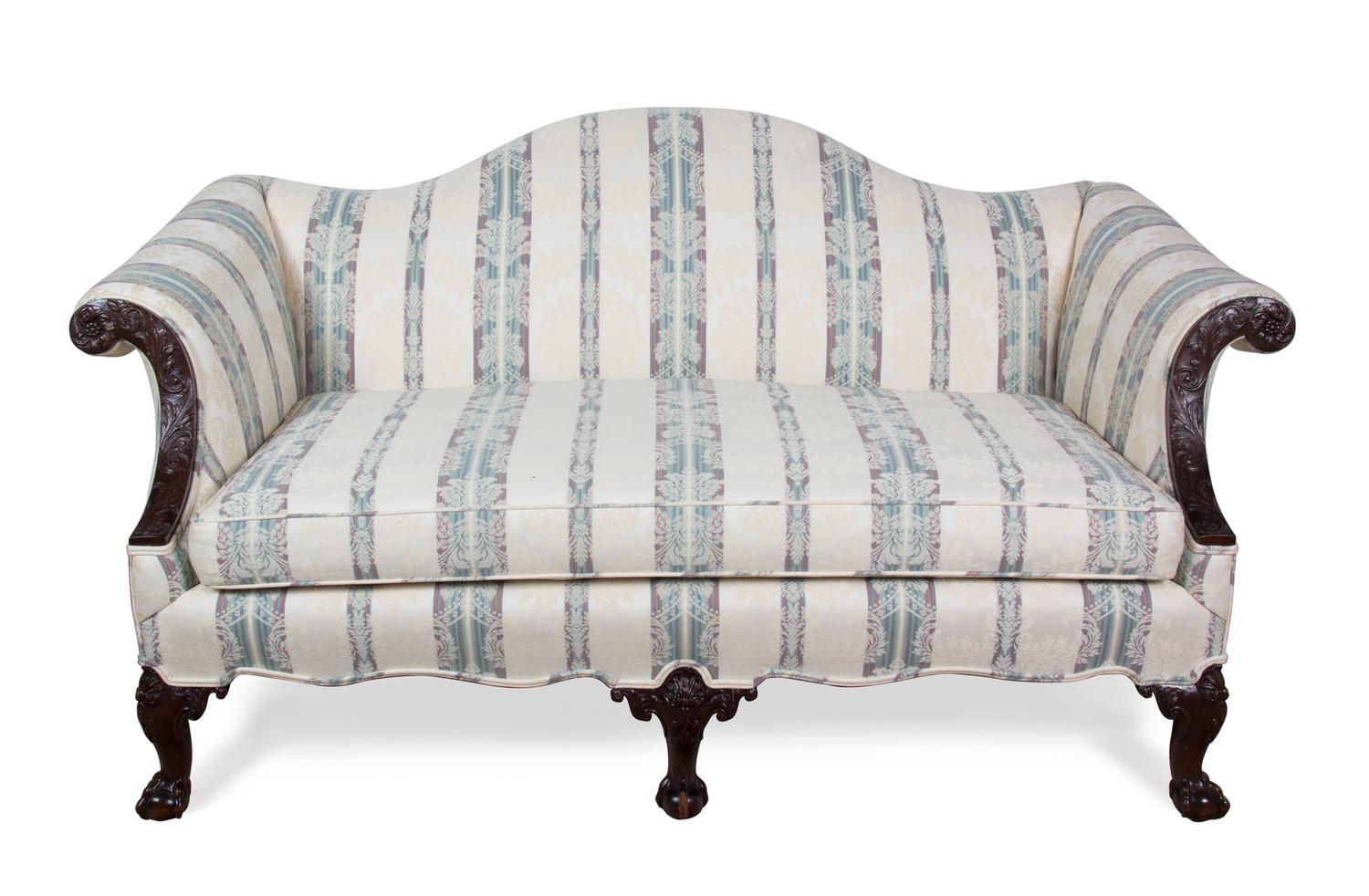 A Chippendale Style Mahogany Camel Back Love Seat Height 34 x width 64 x depth 36 inches. — 20TH CENTURY