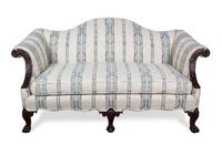 A Chippendale Style Mahogany Camel Back Love Seat Height 34 x width 64 x depth 36 inches. — 20TH CENTURY