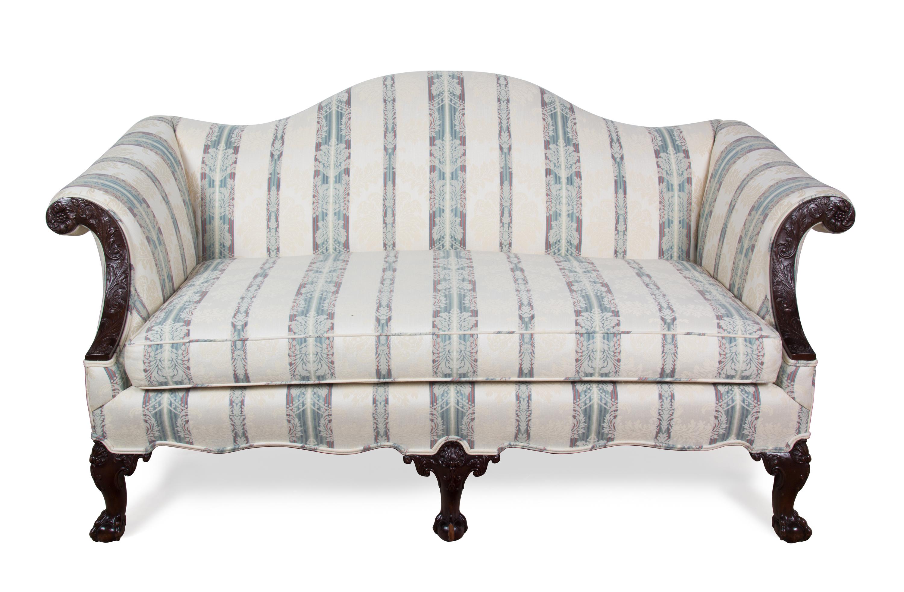 A Chippendale Style Mahogany Camel Back Love Seat Height 34 x width 64 x depth 36 inches. — 20TH CENTURY