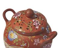 A Wedgwood Polychrome Enameled Rosso Antico Potpourri Jar and Cover