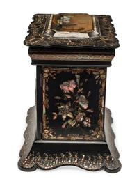 An English Mother-of-Pearl Inlaid Ebonized Cabinet