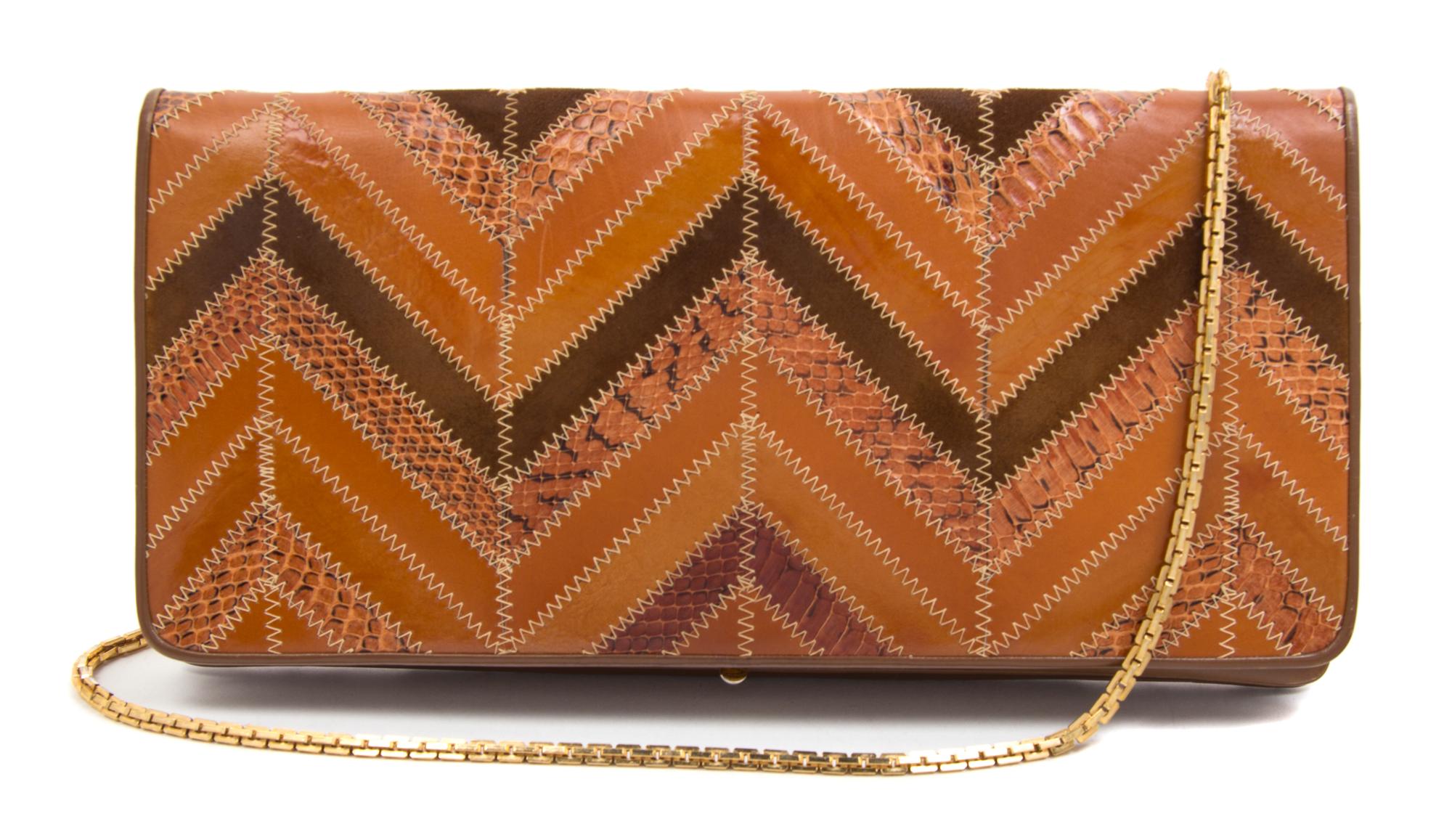 A Judith Leiber Brown Leather Chevron Clutch, 13" x 6.5" x 1".