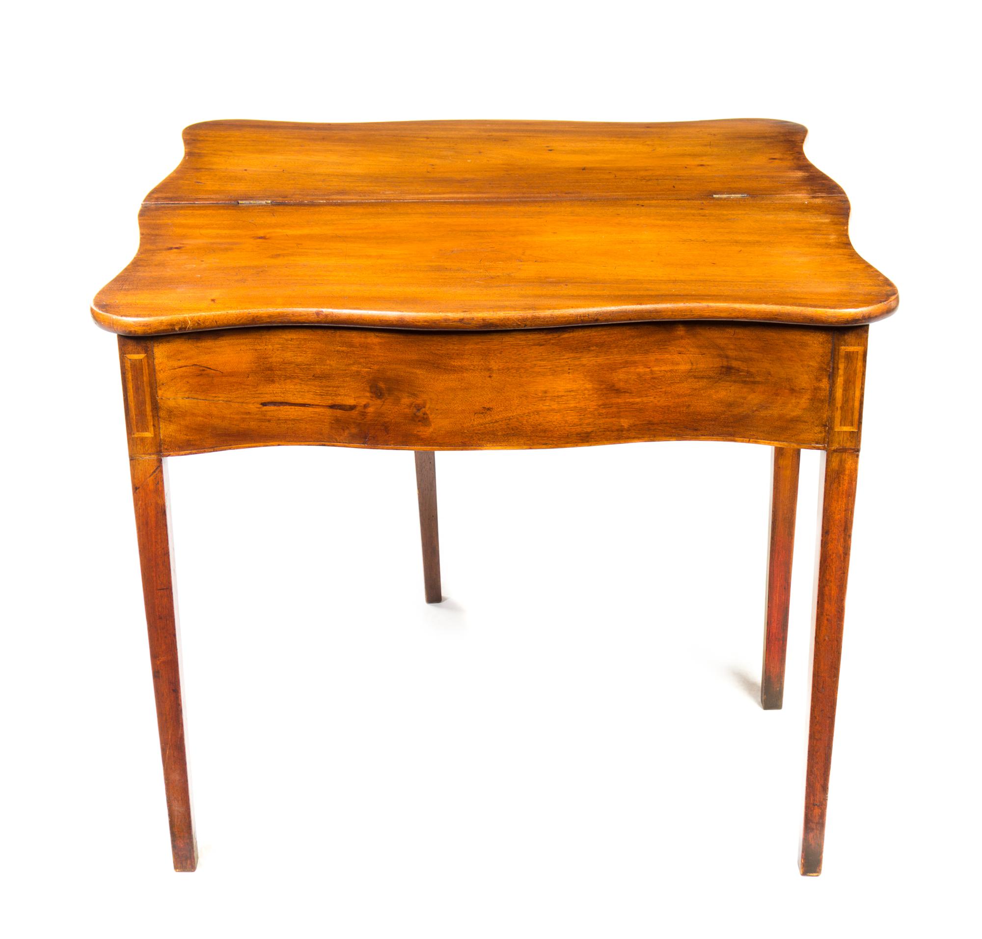 A George III Mahogany Flip-Top Table Height 27 5/8 x width 33 inches. — 19TH CENTURY