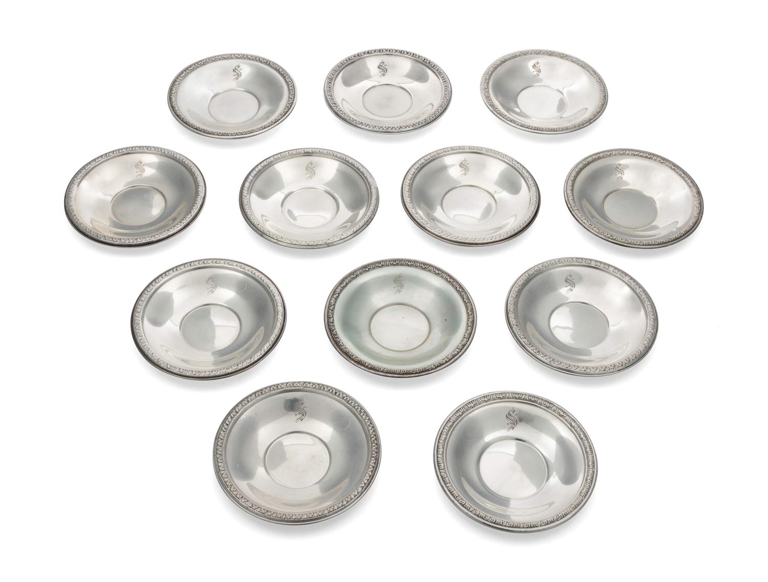 A Set of 12 Silver Butter Pats