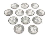 A Set of 12 Silver Butter Pats