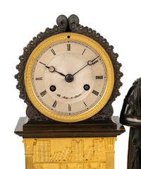 A French Gilt and Patinated Bronze Figural Mantel Clock