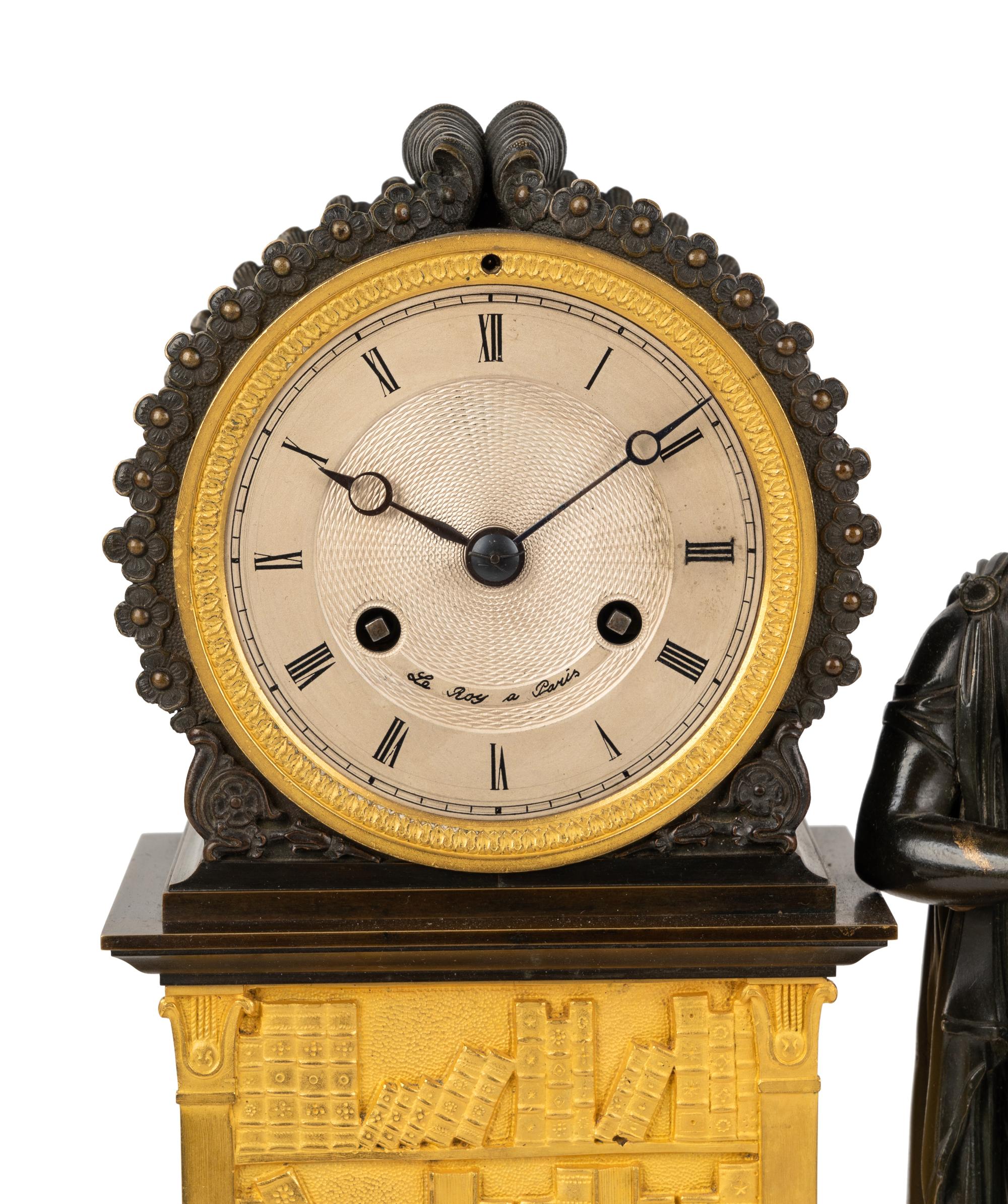A French Gilt and Patinated Bronze Figural Mantel Clock