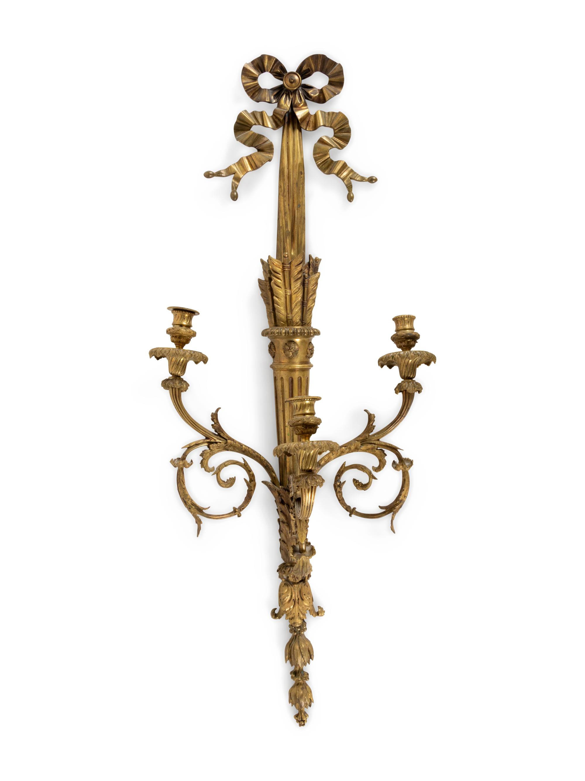 A Louis XVI Style Gilt and Patinated Bronze Three-Light Wall Sconce