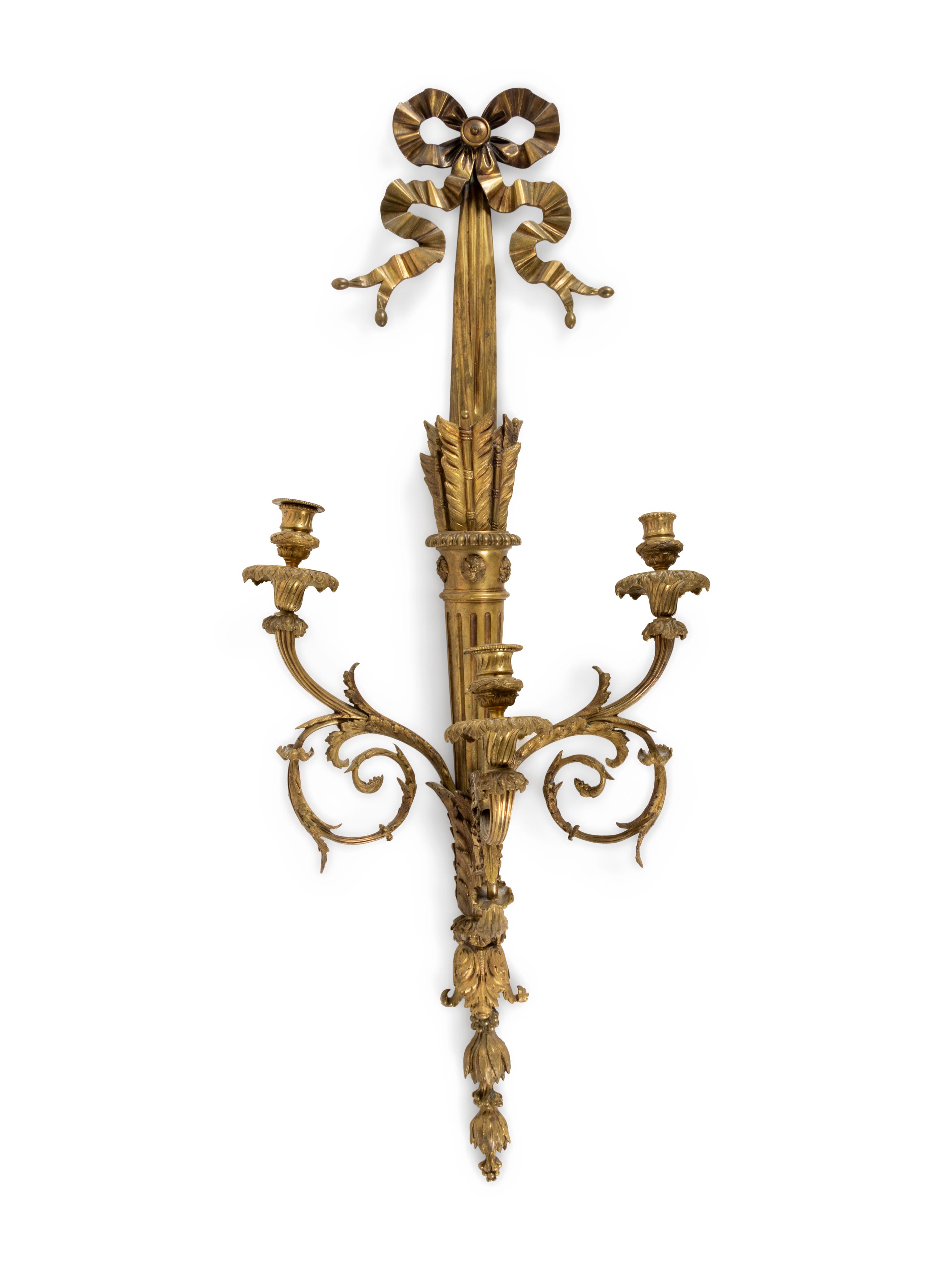 A Louis XVI Style Gilt and Patinated Bronze Three-Light Wall Sconce