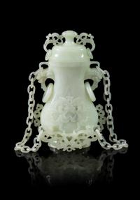 A Celadon Jade Covered Vase Height of vase 4 1/2 inches. — 20TH CENTURY