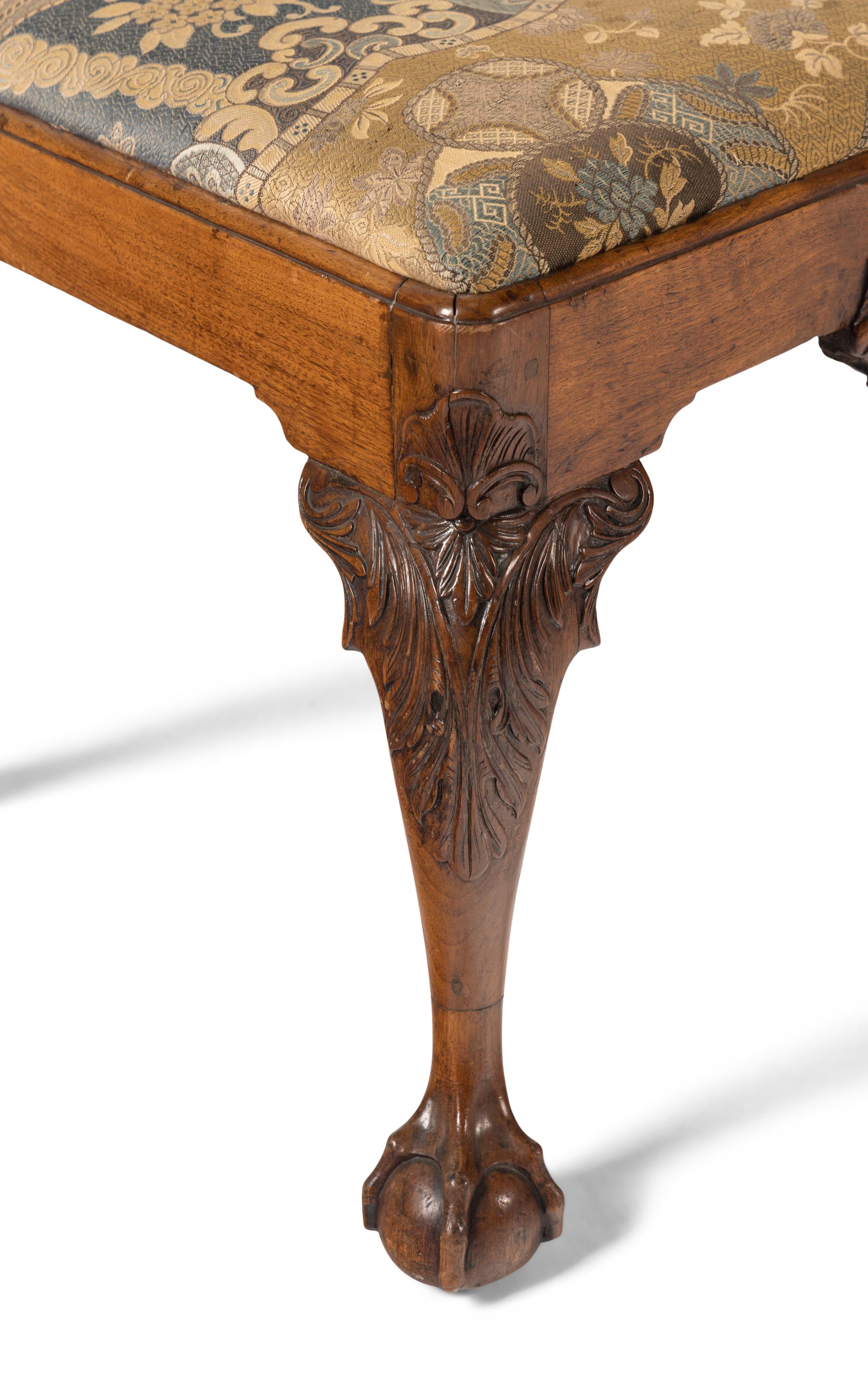 A Group of Four Chippendale Carved Walnut Side Chairs