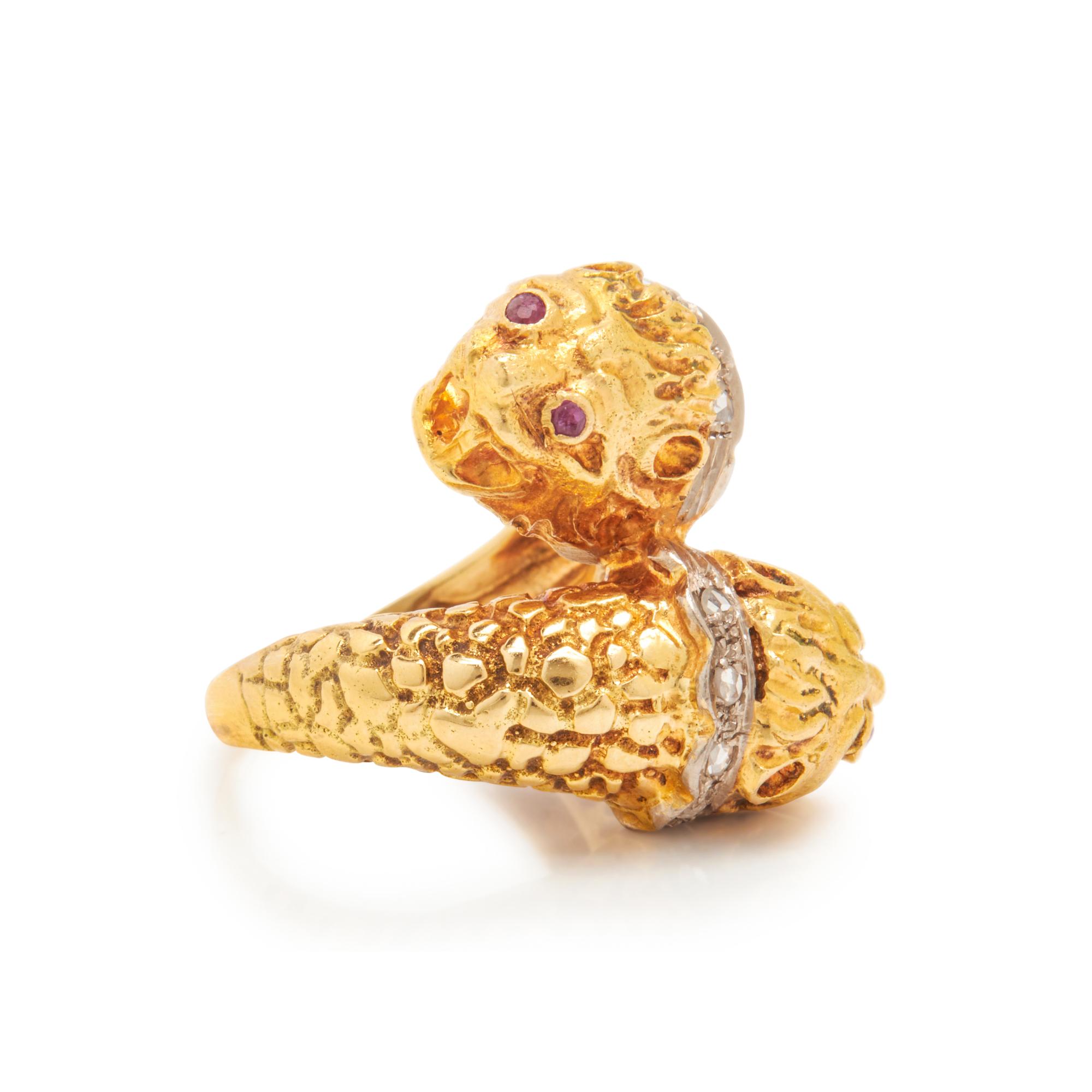 LALAOUNIS, YELLOW GOLD, RUBY, AND DIAMOND LION'S HEAD BYPASS RING
