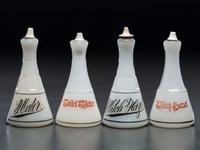 Four Milk Glass Barber Bottles with Ceramic Stoppers