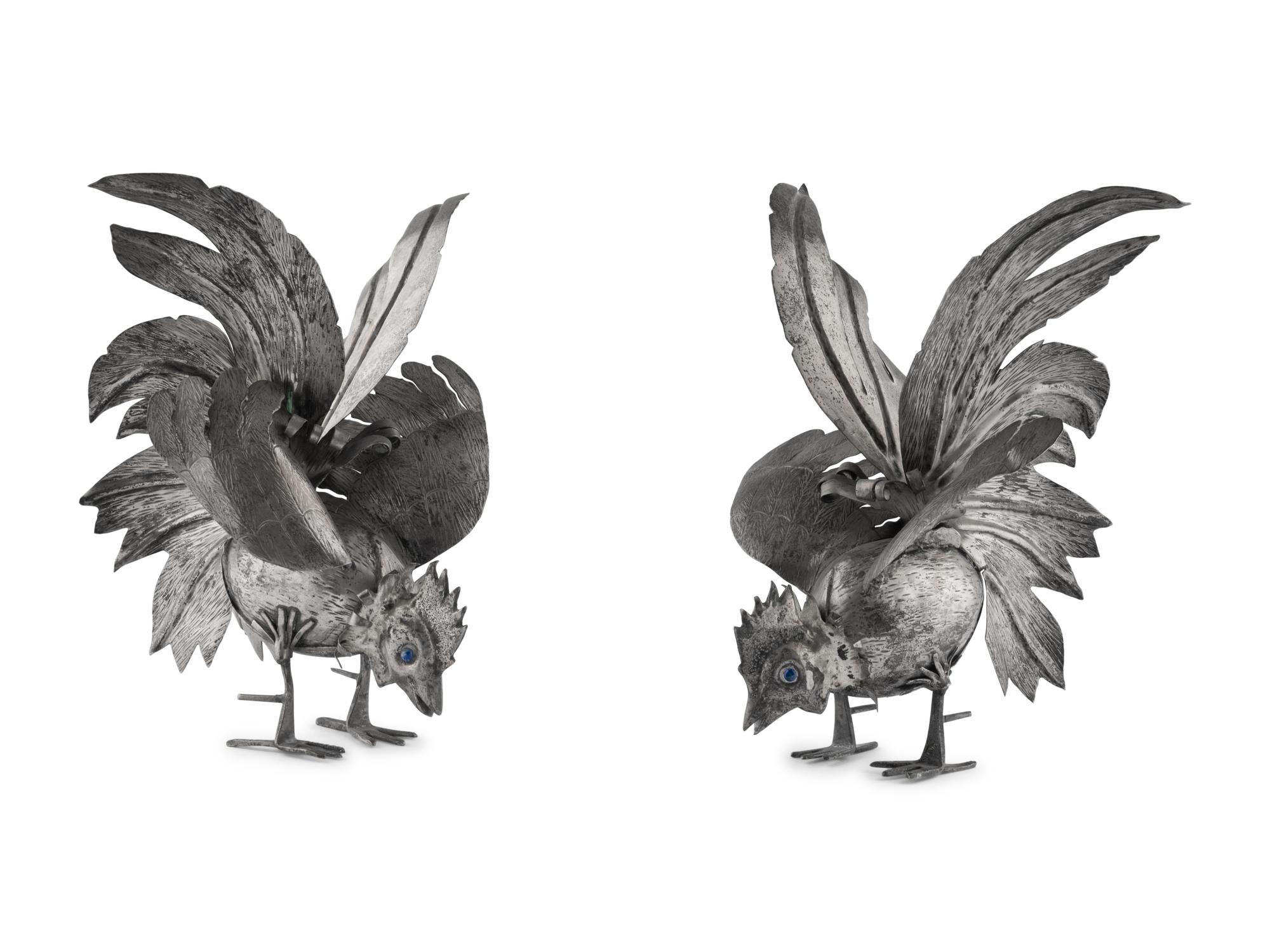 A Pair of Continental Silvered-Metal Roosters
