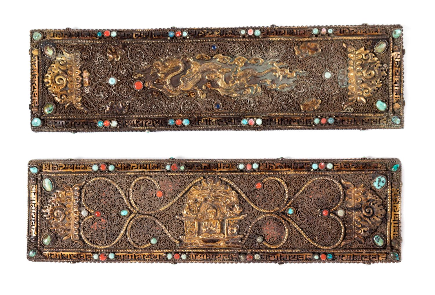 A Pair of Tibetan Parcel-Gilt and Silvered Manuscript Covers