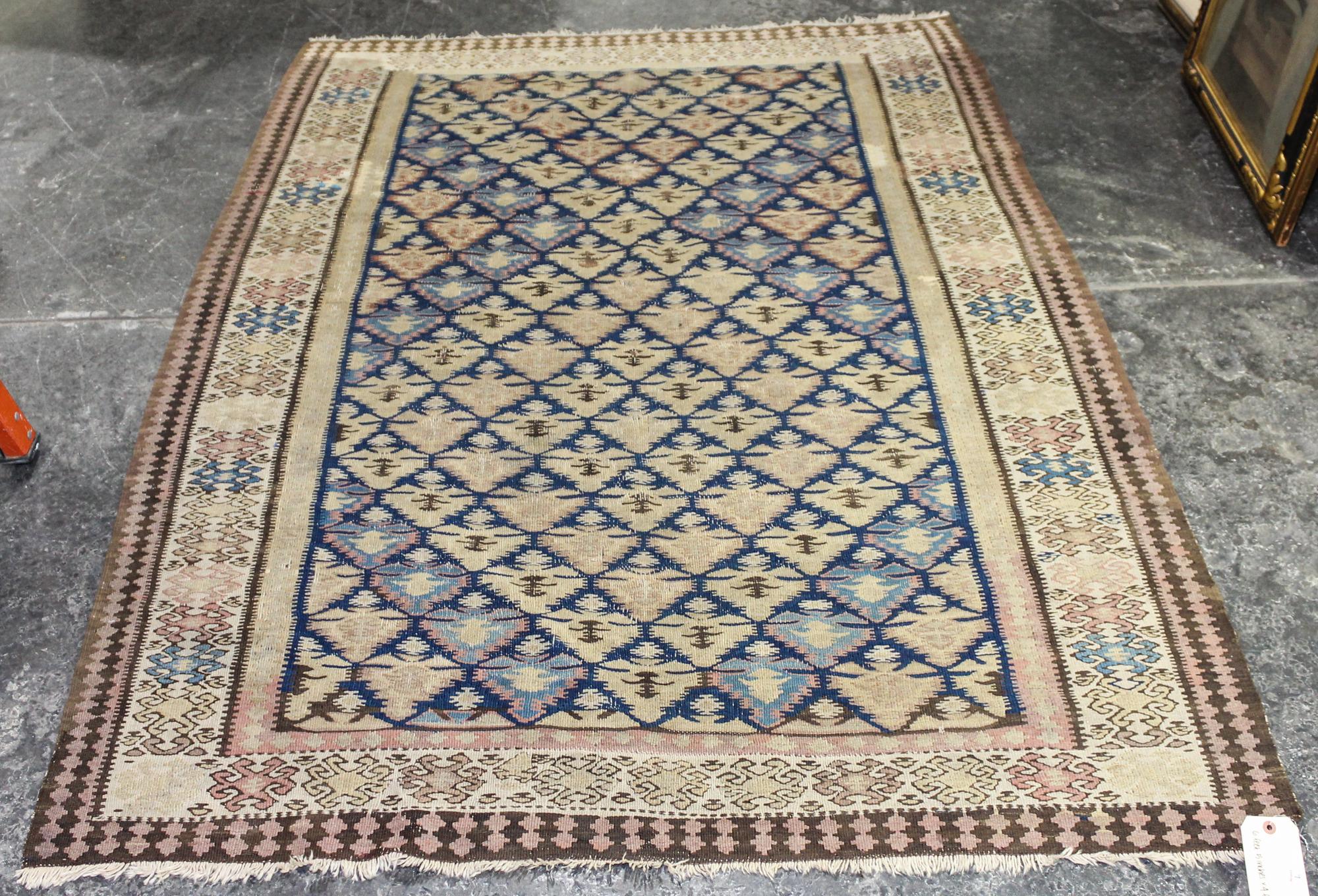 A Kilim Wool Rug 6 feet 5 inches x 4 feet 7 inches. — EARLY TO MID-20TH CENTURY