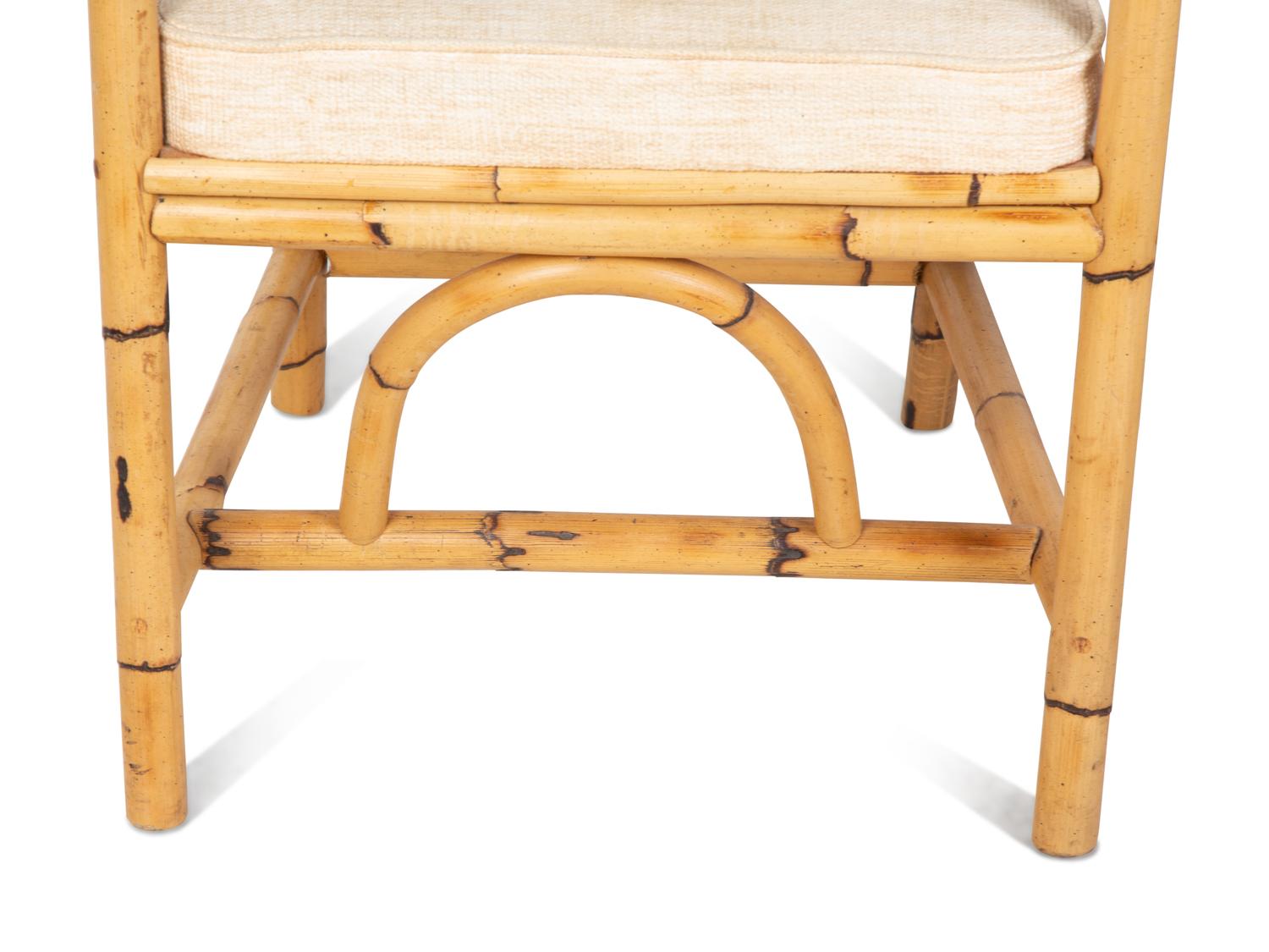 A Bamboo and Rattan Dining Set comprising a table and six chairs.