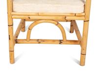 A Bamboo and Rattan Dining Set comprising a table and six chairs.