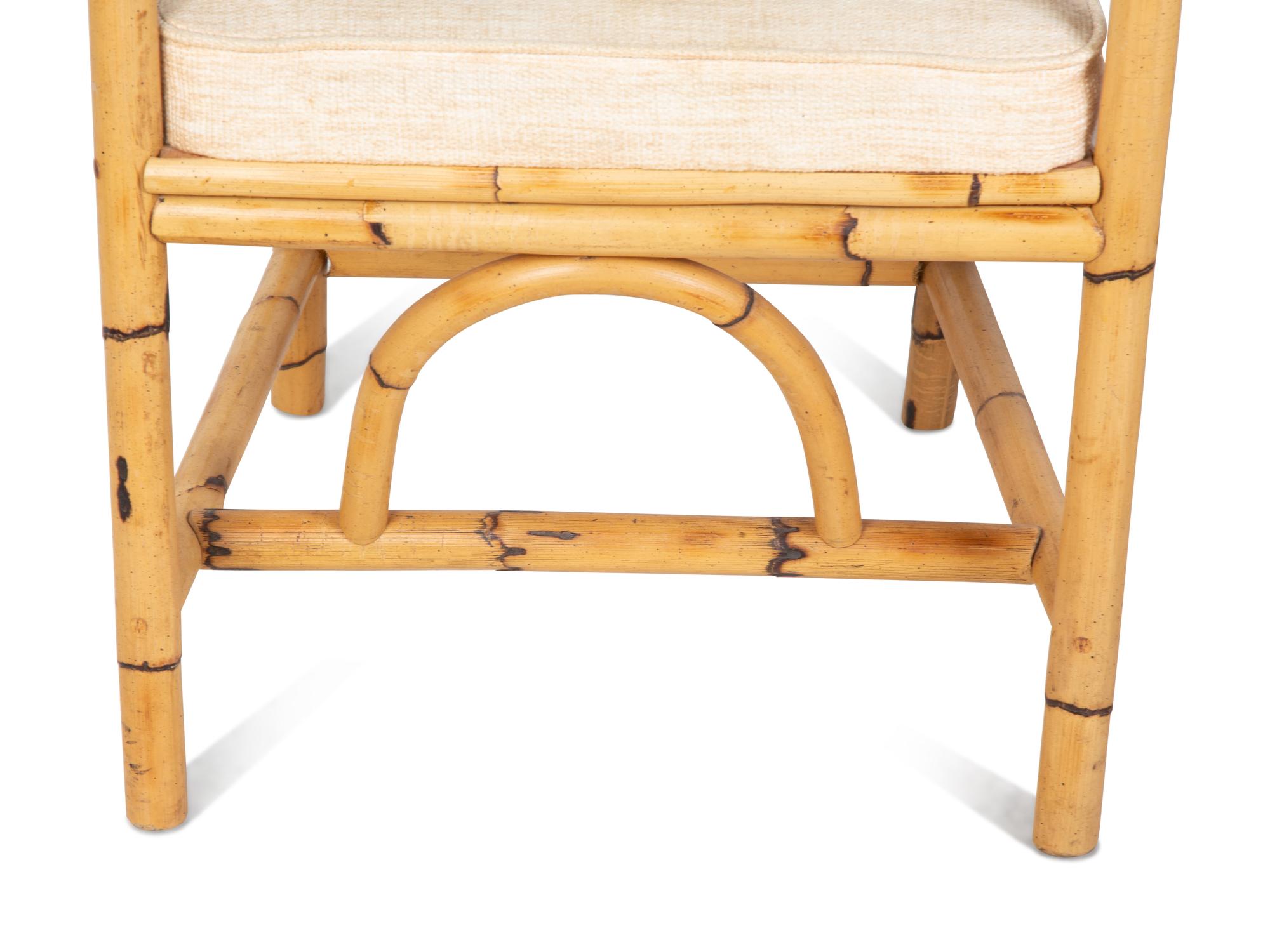 A Bamboo and Rattan Dining Set comprising a table and six chairs.