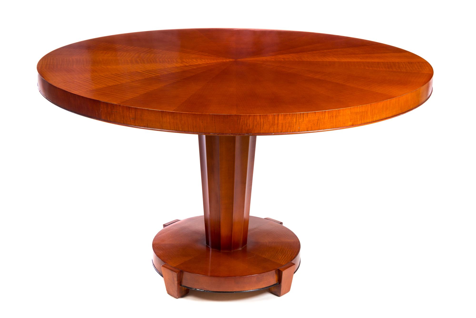An Art Deco Style Satinwood Veneered Table Height 29 x diameter of top 47 inches. — BAKER, 20TH CENTURY
