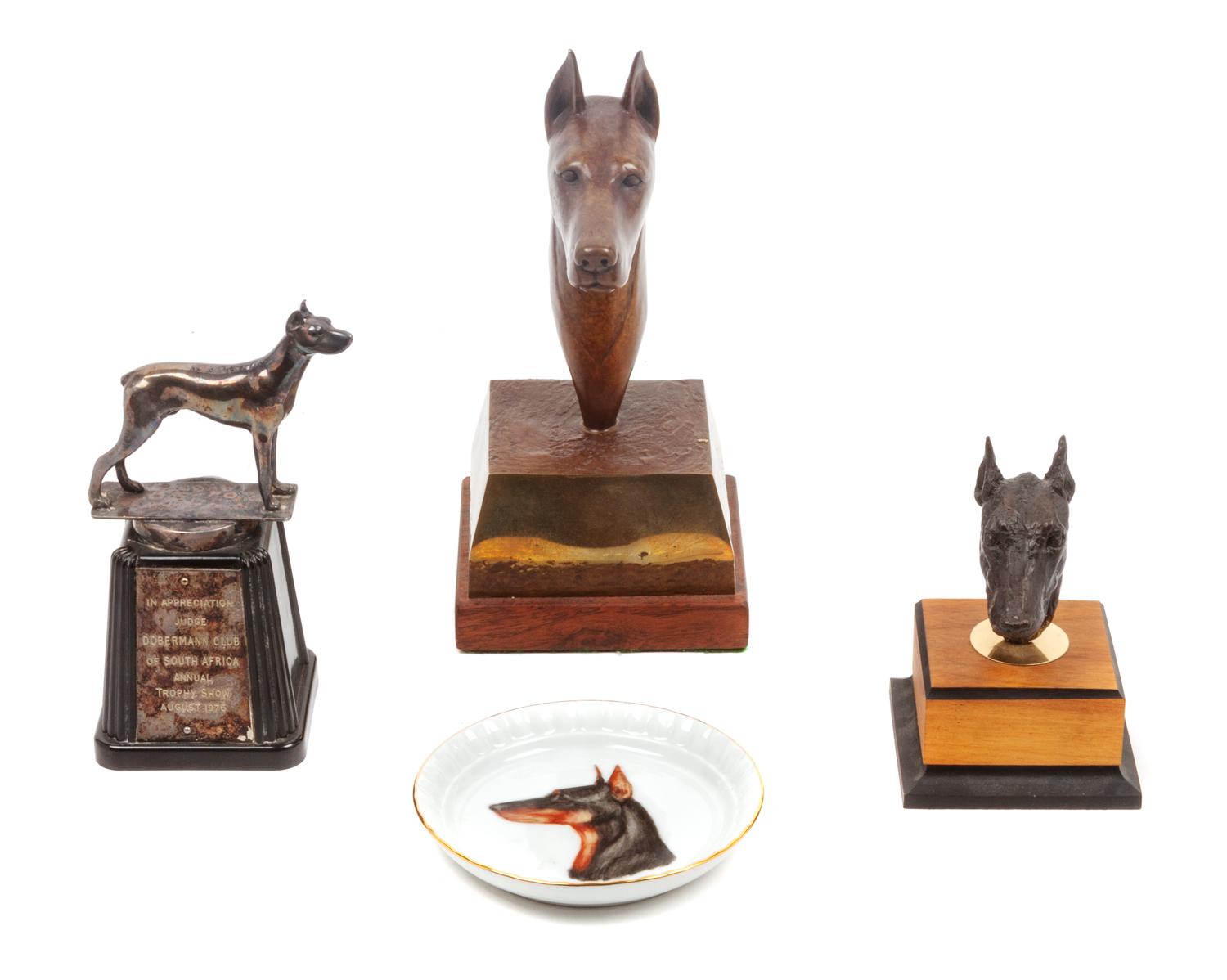A Group of Four Doberman Articles Height of tallest 8 1/4 inches.